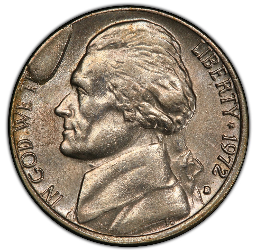 2000-D Jefferson nickel retained die break cud error showing raised featureless blob at the rim